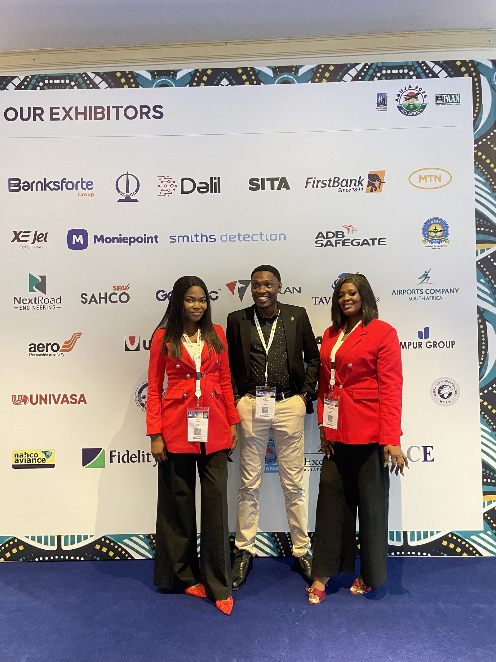 Univasa team at ACI Africa Abuja 2026 exhibitors wall